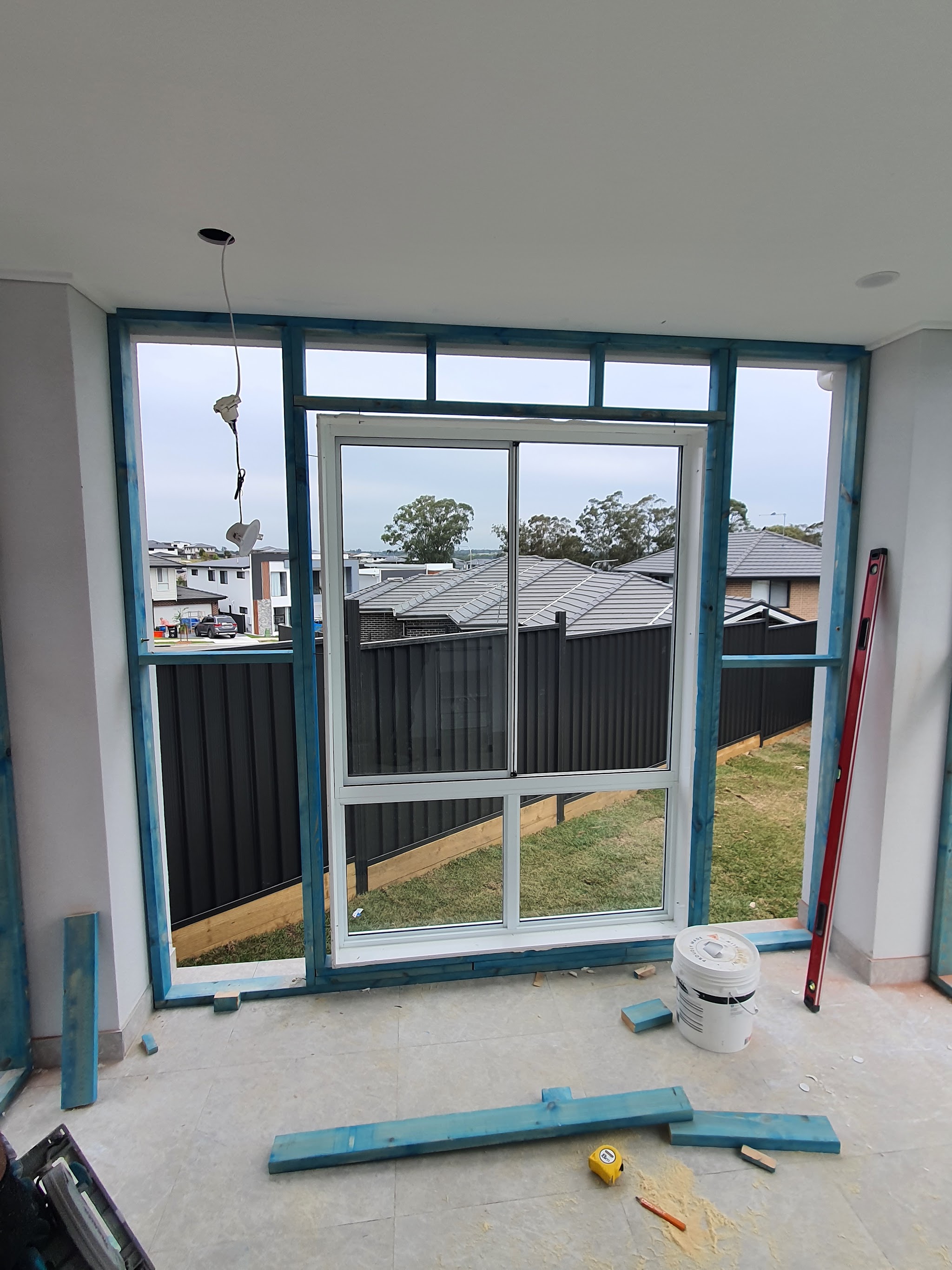 Treated timber framing around a new aluminium window opening